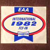 Original EAA Oshkosh 1982 Decal.  Never used 2.75" Plastic Champion Spark Plug issue.